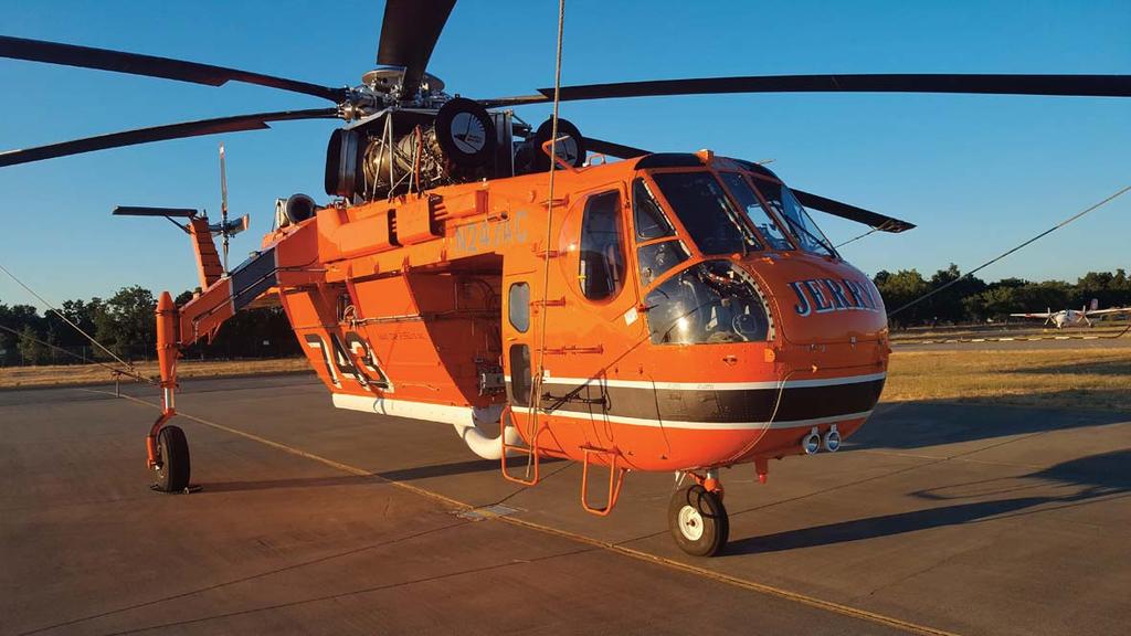 SPECIAL REPORT MEN IN ORANGE AND THEIR WONDERFUL FLYING MACHINE "Jerry"; named after logging manager Jerry Winn, a former employee of Erickson California just signed an exclusive use contract for two