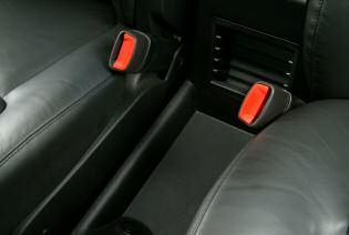 B A pair of cupholders are located in the front portion of the center console (B) and an additional pair of cupholders are located in the rear of the