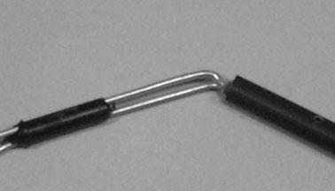 ! Insert the two wires into the double-hole end of the pushrod until the bent ends slide into the holes.