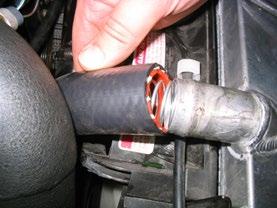 22) The spring should come as close as possible to the radiator end of the hose.