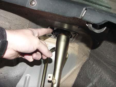 Remove the two lower rear cross beam bolts, the two fuel fill pipe bracket