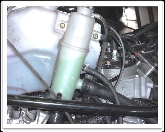 Step 7 Install coolant lines for turbocharger A. Locate the longer water hose and a #4 hose clamp.