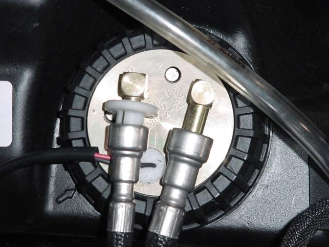 You will need a special quick release tool to remove the fuel lines from your gas tank (see picture). This tool can be found at your local automotive store. G. Remove the throttle Bodies.