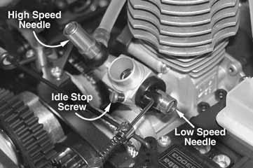 BODY MOUNTING CARBURETOR SETTINGS The High-Speed Needle The high-speed needle is sticking up from the side of the carb. It is located in the brass housing, just above the fuel inlet.