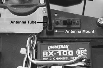 This will make it easier to get the wire through the antenna tube. Slide the antenna wire through the antenna tube.