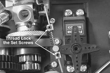 Move the transmitter trigger to apply the brakes and try to gently move the vehicle. If the car rolls freely the quick tune brake adjuster should be threaded on farther.