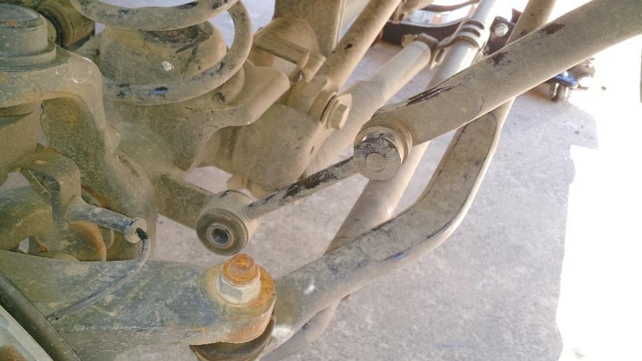 Always disconnect on the trail, and reconnect the end links when back on level pavement. 13. Use cable ties or Zip ties to tie the lower brake mounting bracket to the lower end of the shock.