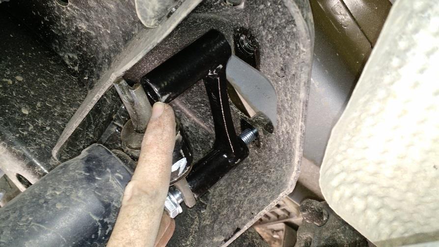 12. Raise the axle up and Compress the shocks by hand in order to line them up to be installed with the shock extension brackets.