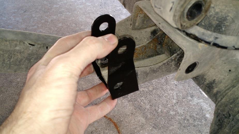 Note: Scrape any paint runs off of the bottom side of the stock mounting point. This will ensure the bracket bolts squarely to the axle.