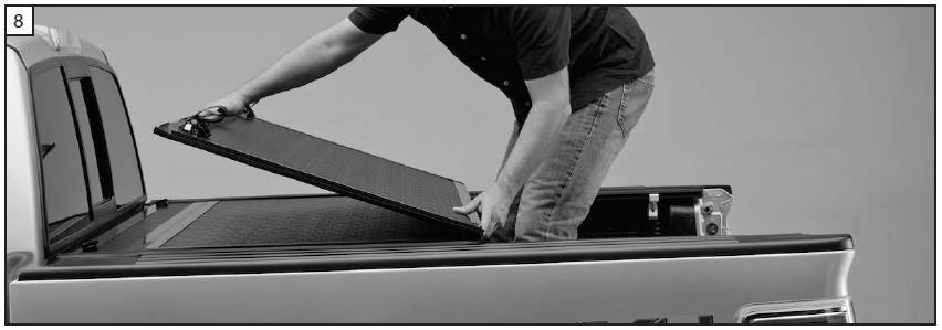 8. Carefully unfold the cover. Position the cover so it is centered side to side and front to back on the truck bed. 9.