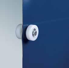 Spring steel wind protectors in curtain pocket The tandem track rollers ensure quiet door travel and allow for higher wind pressures.