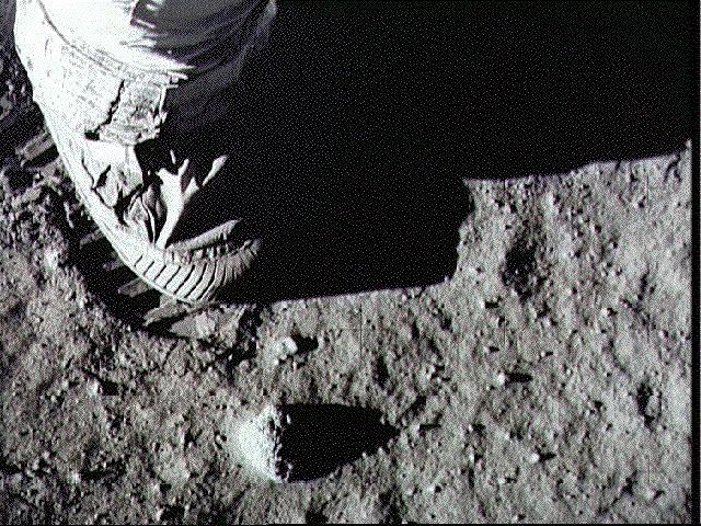 Armstrong's Boot and Footprint on the Lunar Surface 11:05:58 PM T+109:33:58 Armstrong initiates lunar contingency soil sample collection.