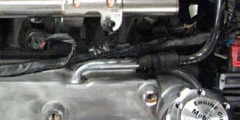 25. Use a fuel line removal tool to disconnect the fuel line from the rails using a shop
