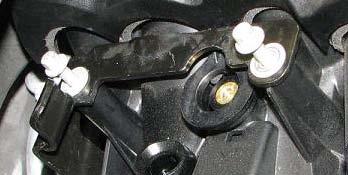 Use an 8mm socket to loosen the two rear passenger side manifold bolts.