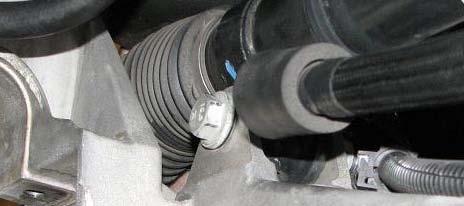 77. Use an 18mm socket to remove the two steering rack nuts and bolts.