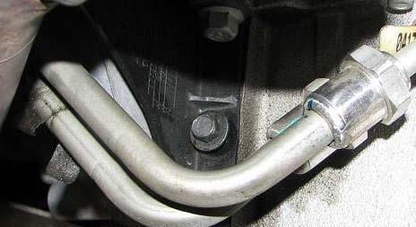 Remove the plastic clamp holding the power steering lines to the steering rack. 79.