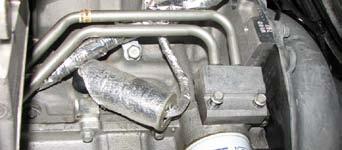 96. Use a 10mm socket to remove the distribution block from the side of the oil pan and discard it. 104.