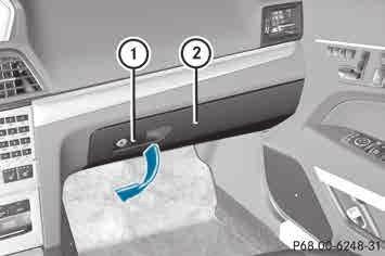 Stowage areas 269 Glove box Stowage compartment under the armrest X To open: pull handle : and open glove box flap ;. X To close: fold glove box flap ; upwards until it engages.
