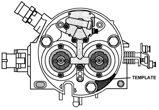 9. Reinstall the fuel cavity cover onto the throttle body. 10. Cut out the template shown in Figure 10. Lay it on the throttle body, as shown in Figure 9. 11.