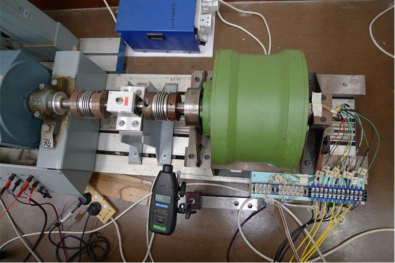 N35. The test-bed is presented in Fig. 16, which includes the memory motor, a DC motor, a torque sensor, a laser tachometer, an electrical load and a 5-phase full-bridge circuit.