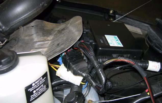 It may be necessary to remove the body panels to access the ECU.