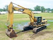 good condition with very good 1997 CAT 325BL, s/n 2JR01040, Cat 3116 dsl engine and hydraulic drive, 10 dipper stick, 63 gp bucket, 15 4 crawlers, and 32  In fair to good condition with fair to good