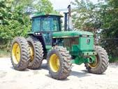 hydraulic outlets, PTO, drawbar, EROPS with ac, light package, and 18.4R26 front and JOHN DEERE 4960 S 18.4-42 rear tires.