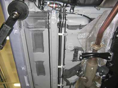 Mount the fuel line and wiring harness with rub protection on sharp edges. WARNING! The fuel line and wiring harness are routed to the metering pump in as shown in the wiring harness routing diagram.