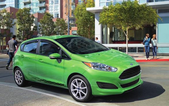 Fiesta Specifications Standard Features Engines/EPA-Estimated Ratings 7 & Dimensions SE Hatchback in Green Envy Metallic Tri-coat customized with side window deflectors, body kit, lower bodyside