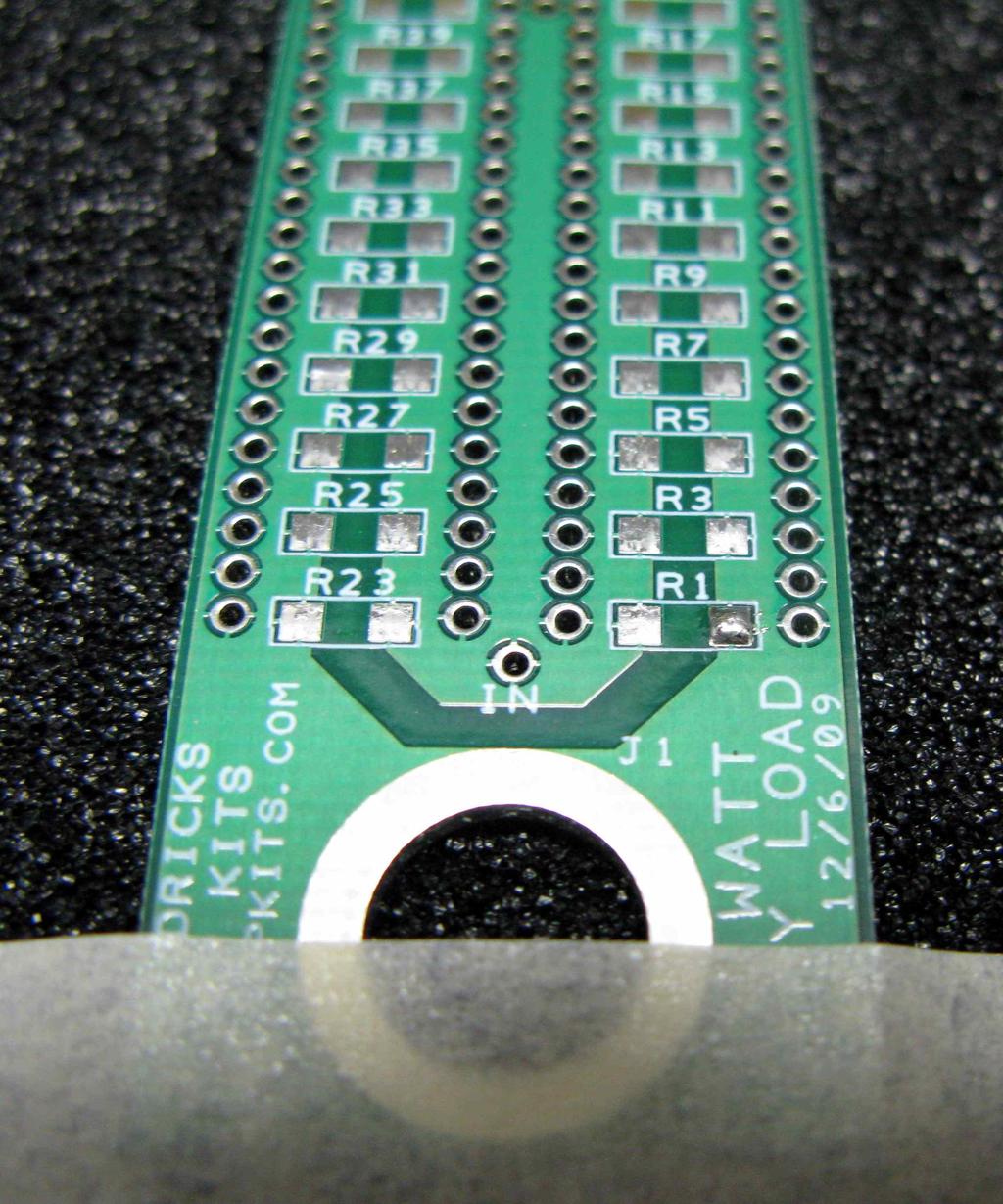 o Orient J2 at the top and we will begin with R1 in the lower right corner. The method we will be using, is to apply a small amount of solder to the right side of the pad as shown below.