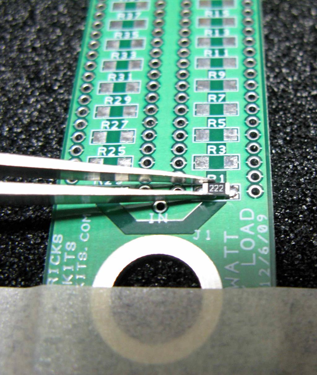 You should feel the resistor settle in place as the solder melts. Now you can now solder the left side of the resistor. Repeat this process for all the odd numbered resistors on this side.