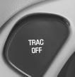 To turn the system on or off, press the TRAC OFF button on the left side of the instrument panel.