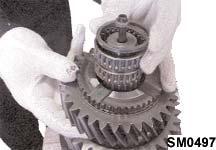 Assemble the puller plates over the 3rd/4th gear synchroniser hub and the 3rd gear synchroniser ring and press off the hub and ring,
