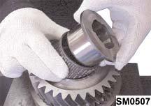 Invert the shaft and remove the 2nd gear bearing sleeve