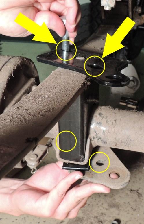 Disconnect the original suspension from the chassis by removing the (4) bolts and the spring retainer plate.