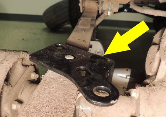 Remove the front portion of the leaf spring by removing front pivot bolt. Retain hardware. 5.