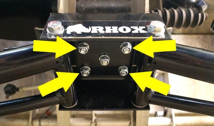 Place a riser block on top of the axle and under the leaf spring.