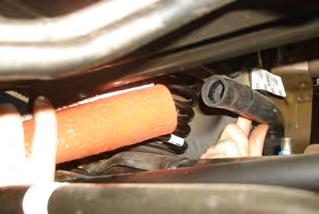 Using provided Protective Sleeve, carefully slide sleeve over fuel-vapor return hose. Re-install zip-tie over Protective Sleeve and reattach c-clip. (See Fig.