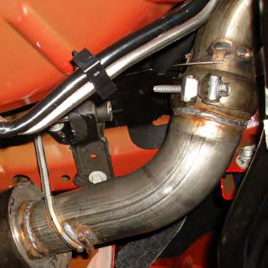 Place the OE band clamp over the expanded end of the (driver side) L/H Over Axle Pipe and position curved end of pipe over axle.