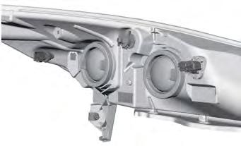 Be sure that the spring clip is not damaged or detached from the headlamp assembly during the replacement procedure.