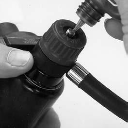 Use the 7/16 wrench to thread the handwheel locknut on the slide. 2. Position the swivel with its grooved end away from the regulator housing.