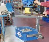 5 5. A VacuMove with a special tool attached for handling crates.