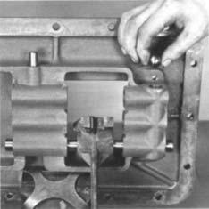 Insert the yoke lockscrew; tighten to 35-45 ft./lbs. of torque and wire securely. 3. Insert an interlock ball in the case boss. CAUTION: Installing the yoke lock screws with more than 45 ft./lbs. of torque can result in distortion of the shift bars.