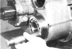 Install the snap ring in the groove on the rear of each countershaft. 2.
