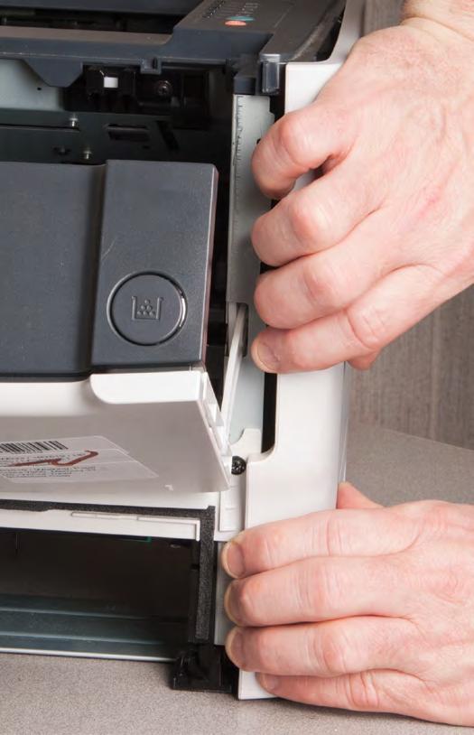 Remove left-side cover: Open the print-cartridge door, then use a flat-blade screwdriver or pick to release two tabs at the back of the printer (Fig.