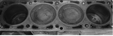 a) b) Figure 5: The outward of cylinder-piston group of Nexia SOHC engines of UZ-Daewoo s vehicles after the testing run of 1935 km, a) controlling vehicle and b) testing vehicle after the run with