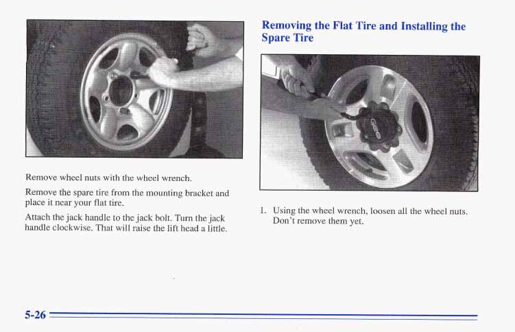 Remove wheel nuts with the wheel wrench. Remove the spare tire from the mounting bracket and place it near your flat tire.