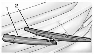 Press the button (2) in the middle of the wiper arm connector, and pull the wiper blade away from the arm connector (1). 3. Remove the wiper blade. 4. Reverse Steps 1 3 for wiper blade replacement.