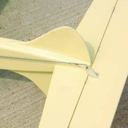 I used a standard 3-inch bellcrank and flexible leadouts and a 3 /32-inch wire pushrod with one support off the fuselage side.