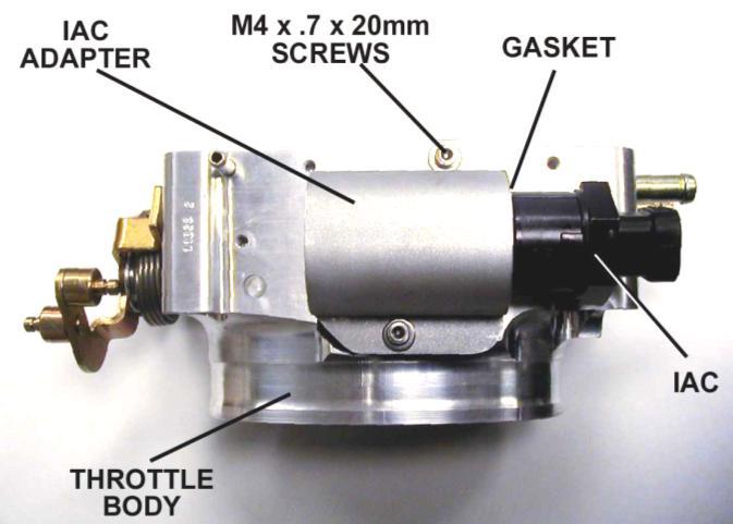 Figure 4 12. Next, install the throttle body. Use the supplied hardware and gasket that comes with the throttle body. 13.